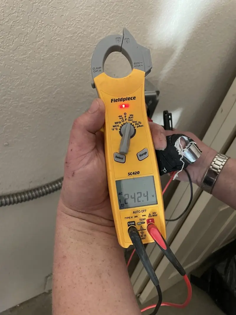 Voltage testing with clamp meter during Outlet Installation in Throop